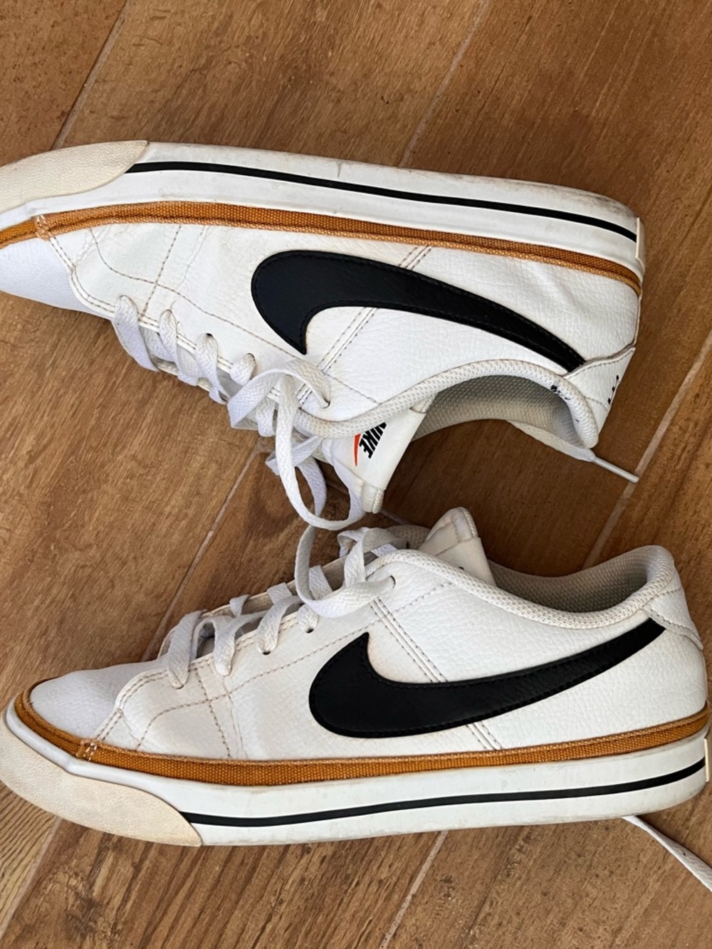 Nike White Leather Low-Top Sneakers with Black Swoosh and Tan Trim